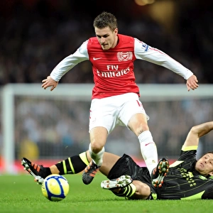Arsenal's Aaron Ramsey Leaps Over Leeds Michael Brown in FA Cup Clash