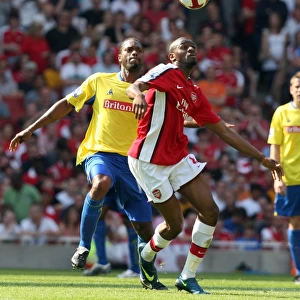 Arsenal's Abou Diaby Overpowers Stoke's Salif Diao: 4-1 Victory in Barclays Premier League at Emirates Stadium (May 2009)