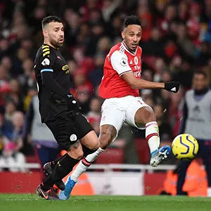 Arsenal's Aubameyang Faces Off Against Manchester City's Otamendi in Premier League Showdown