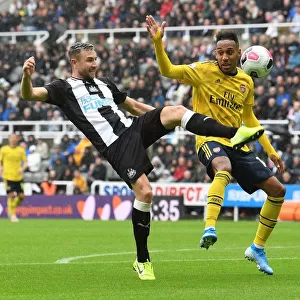 Arsenal's Aubameyang Faces Off Against Newcastle's Dummett in Premier League Clash