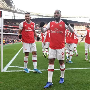 Arsenal's Aubameyang and Lacazette: Celebrating Glory Against Chelsea in a Thrilling Premier League Clash