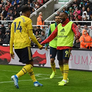 Arsenal's Aubameyang and Lacazette: Unstoppable Duo in Full Swing - Celebrating a Goal Against Newcastle United, 2019-20 Premier League