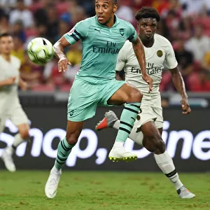 Arsenal's Aubameyang Outmaneuvers PSG's Mbe Soh in International Champions Cup Clash