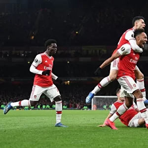 Arsenal's Aubameyang, Saka, and Martinelli Celebrate Goal Against Olympiacos in Europa League