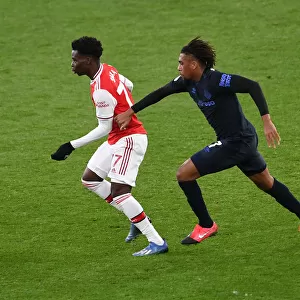 Arsenal's Bukayo Saka Clashes with Everton's Alex Iwobi in Premier League Showdown