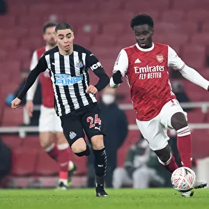 Arsenal's Bukayo Saka Clashes with Newcastle's Miguel Almiron in FA Cup Third Round