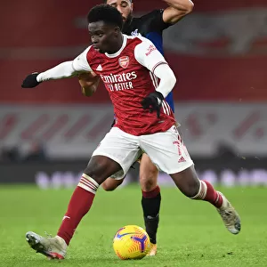 Arsenal's Bukayo Saka Faces Off Against Crystal Palace's Andros Townsend in Empty Emirates Stadium - Premier League Clash, January 2021