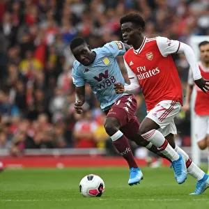 Arsenal's Bukayo Saka vs. Aston Villa's Marvelous Nakamba: A Premier League Battle at Emirates Stadium