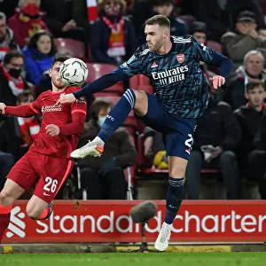 Arsenal's Calum Chambers Faces Off Against Liverpool's Andrew Robertson in Carabao Cup Semi-Final Clash