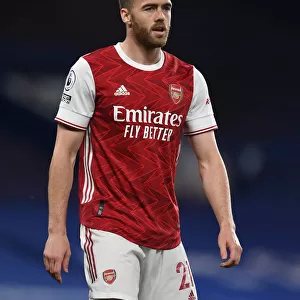Arsenal's Calum Chambers at Empty Stamford Bridge: 2020-21 Premier League Match Amidst COVID-19 Restrictions