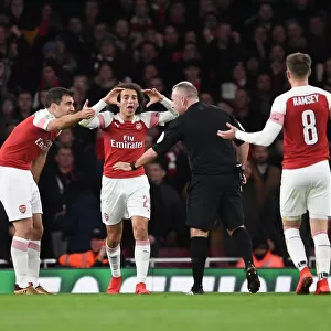 Arsenal's Contentious Carabao Cup Clash: Sokratis, Guendouzi, and Ramsey Protest Referee's Call against Tottenham