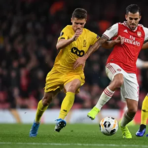 Arsenal's Dani Ceballos Clashes with Standard Liege's Aleksander Boljevic in Europa League Showdown