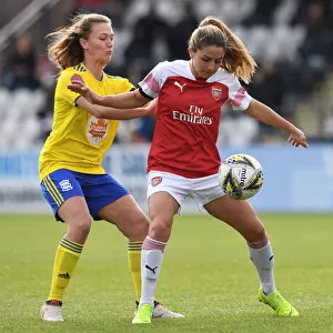 Arsenal's Danielle van de Donk Shields the Ball from Birmingham's Kerys Harrop in WSL Clash