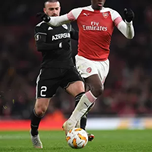Arsenal's Eddie Nketiah Clashes with Qarabag's Gara Gareyev in Europa League Showdown