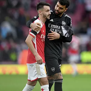 Arsenal's Embrace: Fabio Vieira and David Raya Celebrate Victory Over Sheffield United (2023-24)