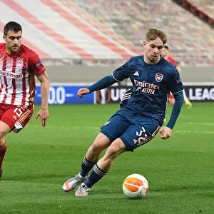 Arsenal's Emile Smith Rowe Faces Off Against Olympiacos Sokratis in Empty Europa League Stadium