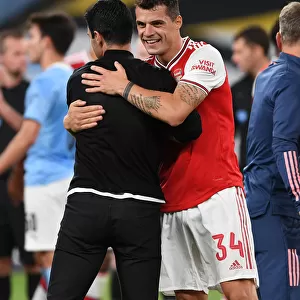Arsenal's FA Cup Semi-Final Triumph: Mikel Arteta and Granit Xhaka Embrace Victory over Manchester City