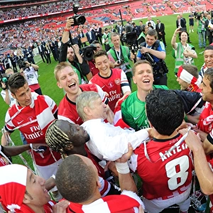 Arsenal's FA Cup Triumph: Arsene Wenger and the Jubilant Squad Celebrate