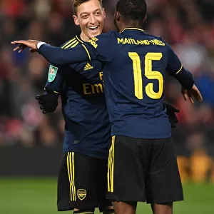 Arsenal's Four-Goal Blitz: Ozil and Maitland-Niles Jubilant Moment at Anfield