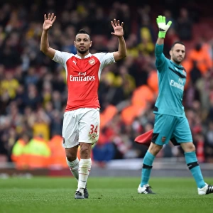 Arsenal's Francis Coquelin Celebrates with Fans after Securing Victory over Watford