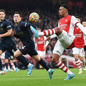 Arsenal's Gabriel Magalhaes Faces Off Against Burnley's Connor Roberts in Intense Premier League Clash