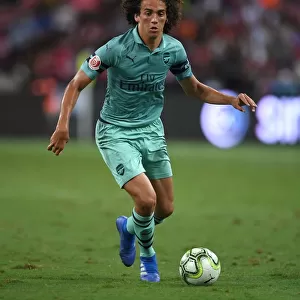 Arsenal's Guendouzi Takes on Paris Saint-Germain: A Clash of Rising Stars in International Champions Cup (2018, Singapore)