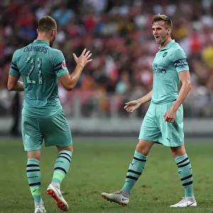 Arsenal's Holding and Chambers Celebrate Goal Against Paris Saint-Germain in 2018 International Champions Cup, Singapore