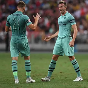 Arsenal's Holding and Chambers Celebrate Goal Against Paris Saint-Germain in 2018 International Champions Cup, Singapore