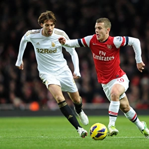 Arsenal's Jack Wilshere Clashes with Swansea's Miguel Michu in Premier League Showdown (2012-13)