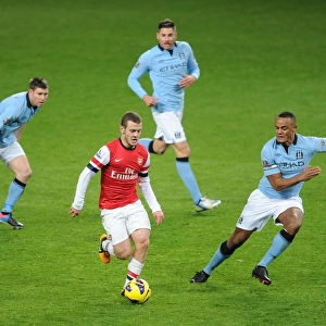 Arsenal's Jack Wilshere Faces Off Against Manchester City's Milner, Garcia, and Kompany