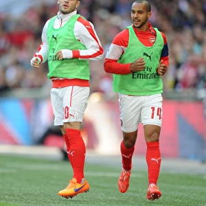 Arsenal's Jack Wilshere and Theo Walcott Warm Up for FA Cup Semi-Final Against Reading