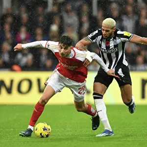 Arsenal's Kai Havertz Faces Off Against Newcastle's Joelinton in Premier League Clash (2023-24)