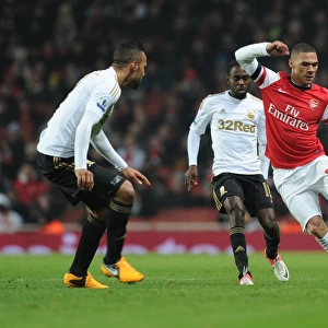 Arsenal's Kieran Gibbs Dashes Past Swansea's Defense in FA Cup Third Round Replay