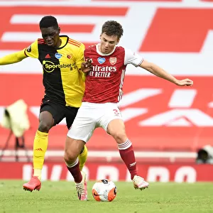 Arsenal's Kieran Tierney Clashes with Ismaila Sarr in Intense Premier League Face-off