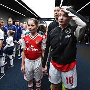 Arsenal's Kim Little and Mascot Before Tottenham Clash in FA Womens Super League