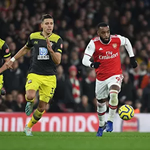 Arsenal's Lacazette Outmaneuvers Southampton's Bednarek in Premier League Clash
