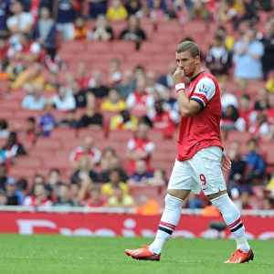 Arsenal's Lukas Podolski in Action against Aston Villa (2013-14 Premier League)