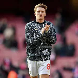 Arsenal's Martin Odegaard Acknowledges Fans in Warm-ups Before Arsenal v Brighton & Hove Albion, 2023-24