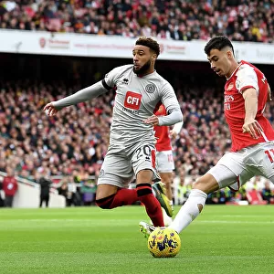 Arsenal's Martinelli Faces Off Against Sheffield United's Bogle: A Premier League Showdown (2023-24)