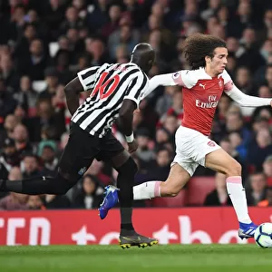 Arsenal's Matteo Guendouzi Outmaneuvers Newcastle's Mo Diame in Premier League Clash