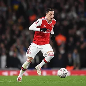 Arsenal's Mesut Ozil in Action against Leeds United in FA Cup Third Round