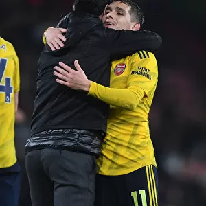 Arsenal's Mikel Arteta Embraces Lucas Torreira Amidst AFC Bournemouth Clash (2019-20)