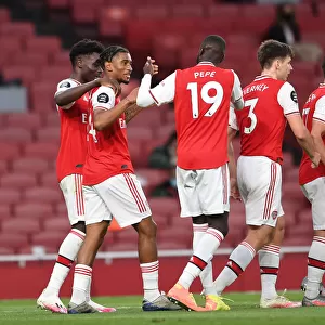 Arsenal's Nelson and Pepe Celebrate Goals in Empty Emirates Stadium: Arsenal vs. Liverpool, Premier League 2019-2020