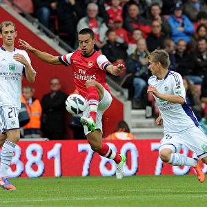 Arsenal's Nico Yennaris Faces Off Against Dennis Praet and Tom De Sutter of Anderlecht in Pre-Season Clash