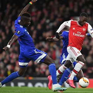Arsenal's Nicolas Pepe Outsmarts Pape Abou Cisse: Thrilling Europa League Clash at Emirates Stadium