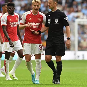 Arsenal's Odegaard Discusses Calls with Referee during FA Community Shield Clash vs Manchester City (2023-24)
