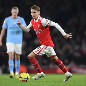 Arsenal's Odegaard Takes on Manchester City: A Midfield Battle
