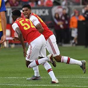 Arsenal's Olayinka and John-Jules: Celebrating a Goal Against the Colorado Rapids