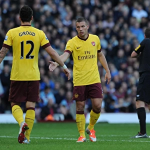 Arsenal's Podolski and Giroud in Action against West Ham United (2012-13)
