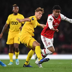 Arsenal's Reiss Nelson Clashes with Standard Liege's Mergim Vojvoda in Europa League Showdown